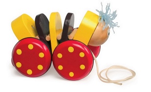 Zabawka na sznureczku. Piesek